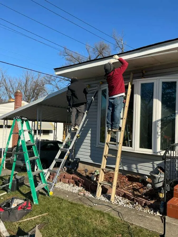 Restoration crew performing exterior repair in Dayton